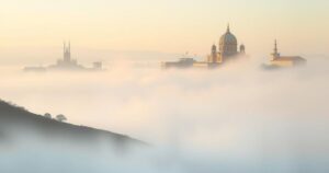 Foggy Lebanese landscape with ethereal mountains and faint outlines of political buildings, evoking a sense of uncertainty.